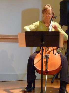 Alumnus playing cello