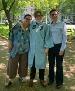 Ruby Landau-Pincus with her parents during graduation