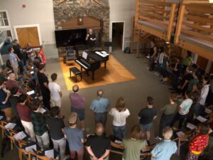 Chorus in the boathouse with Thomas Colohan